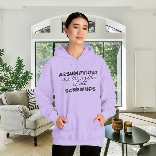Assumptions are the Mother of All Screwups Heavy Blend™ Hooded Sweatshirt