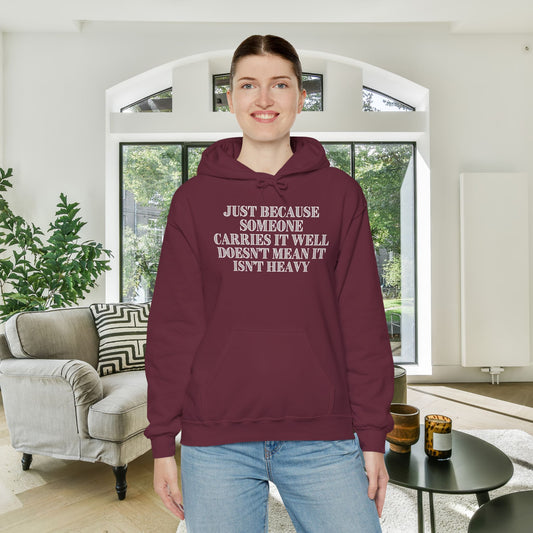 Just Because Someone Carries It Well Doesn't Mean It Isn't Heavy Heavy Blend™ Hooded Sweatshirt