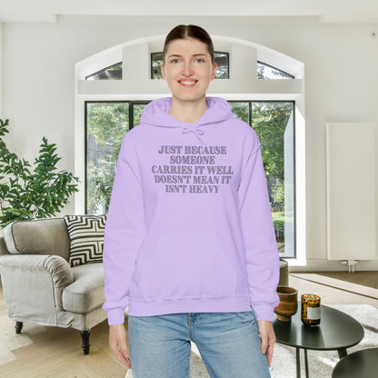 Just Because Someone Carries It Well Doesn't Mean It Isn't Heavy Heavy Blend™ Hooded Sweatshirt