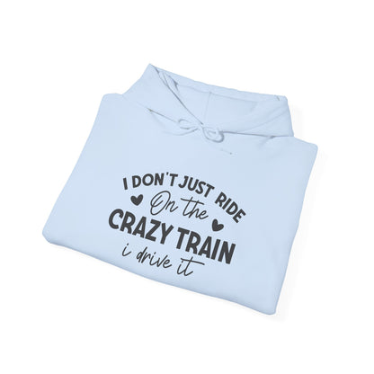 I Don't Just Ride On The Crazy Train, I Drive It Heavy Blend™ Hooded Sweatshirt