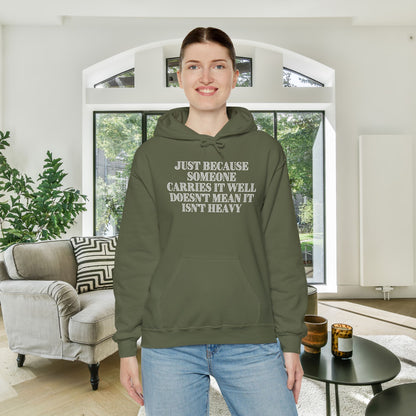 Just Because Someone Carries It Well Doesn't Mean It's Heavy Heavy Blend™ Hooded Sweatshirt