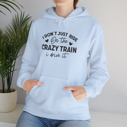 I Don't Just Ride On The Crazy Train, I Drive It Heavy Blend™ Hooded Sweatshirt