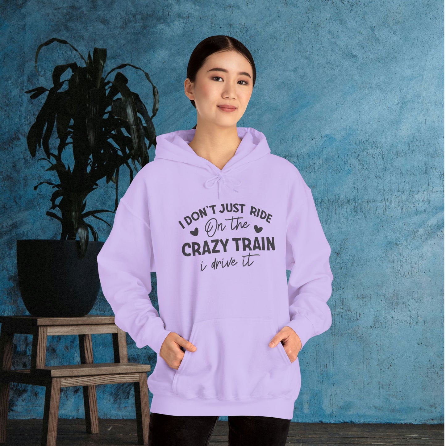 I Don't Just Ride On The Crazy Train, I Drive It Heavy Blend™ Hooded Sweatshirt