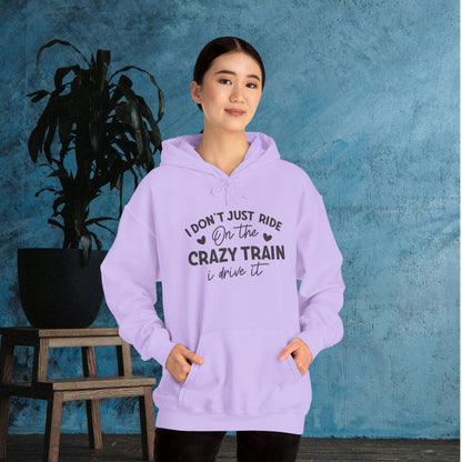 I Don't Just Ride On The Crazy Train, I Drive It Heavy Blend™ Hooded Sweatshirt