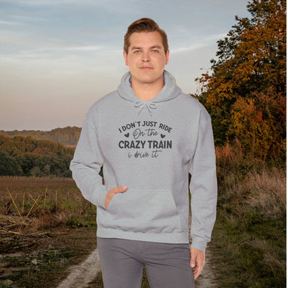 I Don't Just Ride On The Crazy Train, I Drive It Heavy Blend™ Hooded Sweatshirt