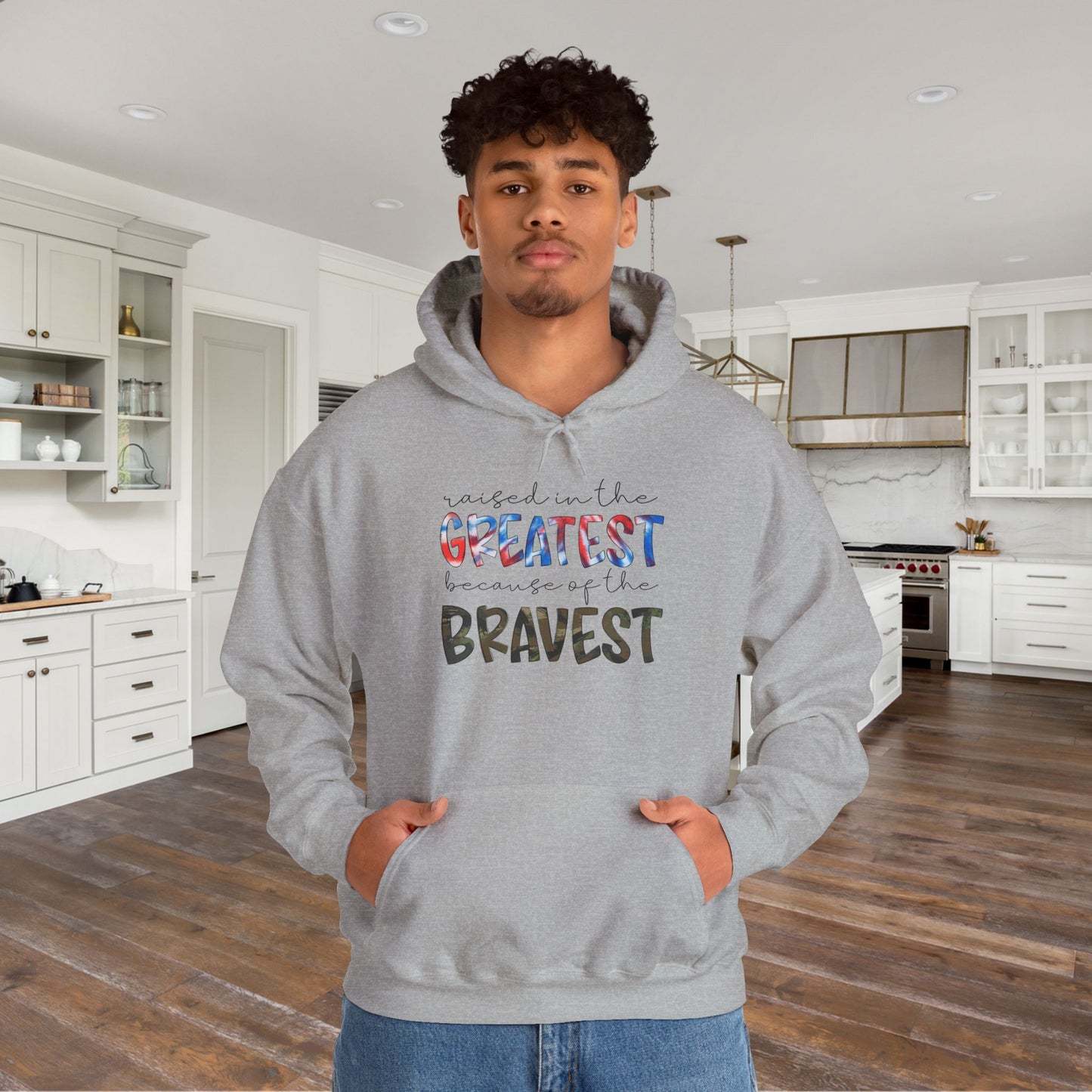 Raised In The Greatest Because Of The Bravest Heavy Blend™ Hooded Sweatshirt