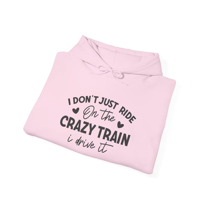 I Don't Just Ride On The Crazy Train, I Drive It Heavy Blend™ Hooded Sweatshirt