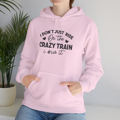 I Don't Just Ride On The Crazy Train, I Drive It Heavy Blend™ Hooded Sweatshirt