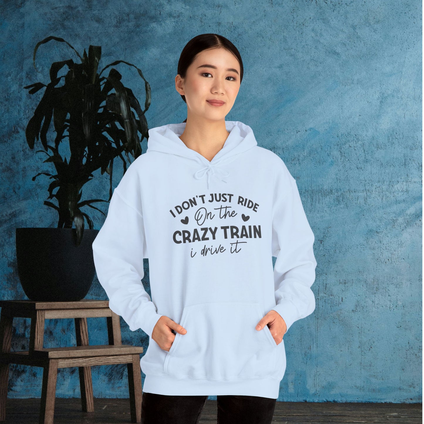 I Don't Just Ride On The Crazy Train, I Drive It Heavy Blend™ Hooded Sweatshirt