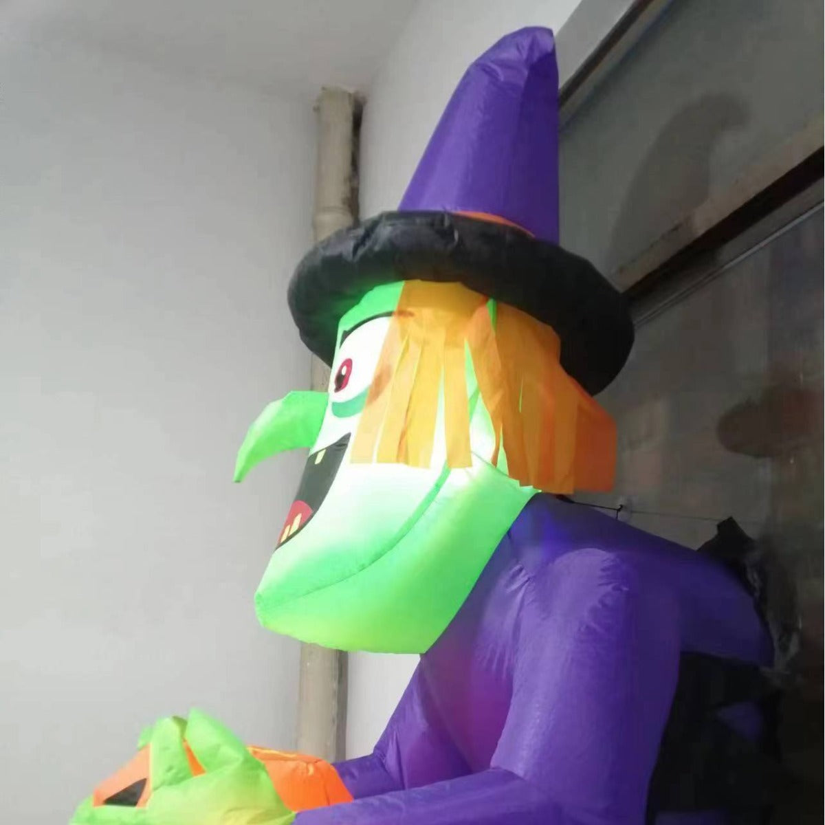 Inflatable Window Witch Holding a Pumpkin Decor