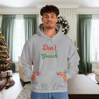 Don't Be A Grinch Adult Heavy Blend™ Hooded Sweatshirt