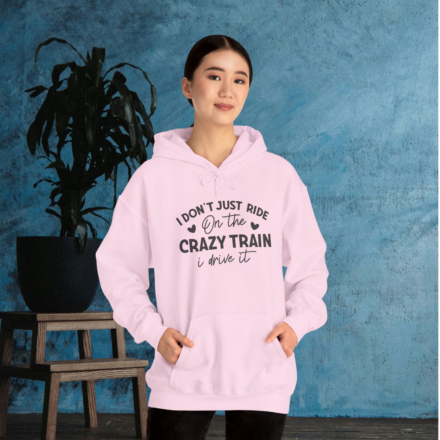 I Don't Just Ride On The Crazy Train, I Drive It Heavy Blend™ Hooded Sweatshirt
