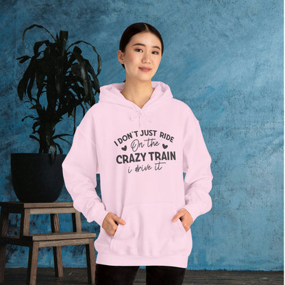 I Don't Just Ride On The Crazy Train, I Drive It Heavy Blend™ Hooded Sweatshirt