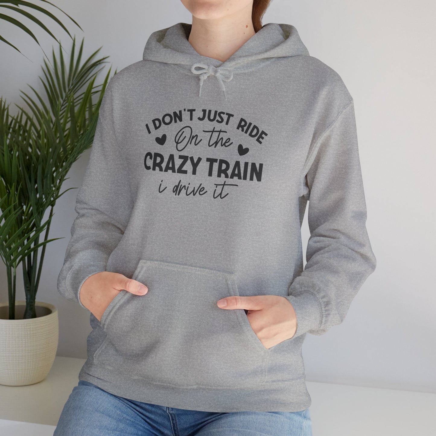 I Don't Just Ride On The Crazy Train, I Drive It Heavy Blend™ Hooded Sweatshirt