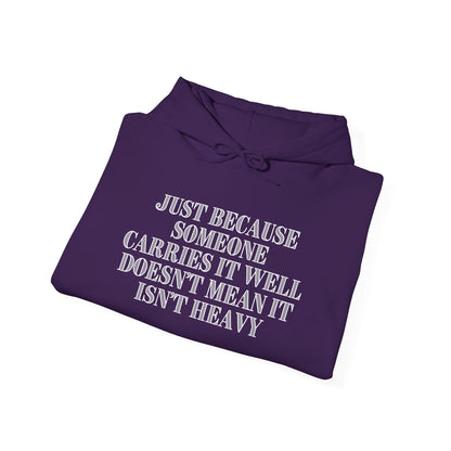 Just Because Someone Carries It Well Doesn't Mean It Isn't Heavy Heavy Blend™ Hooded Sweatshirt